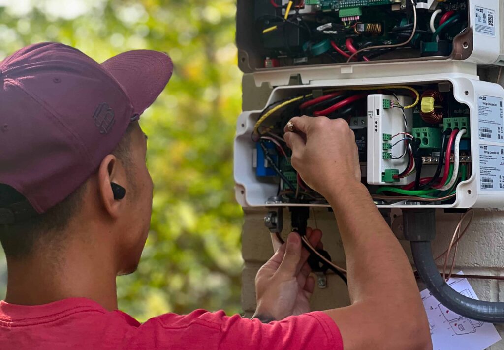 solar worker installing wires